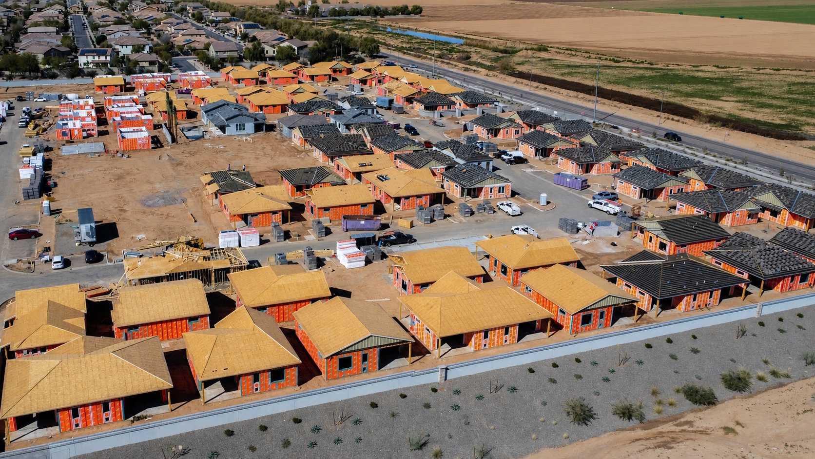 Aerial view of a large Arizona production residential community in multiple stages of framing